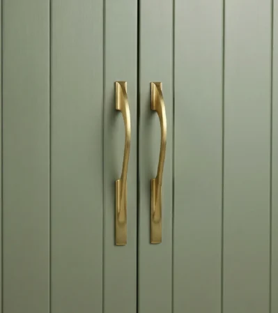 Aluminum Cabinet Handle in Brushed Gold finish on sage green shaker cabinet door